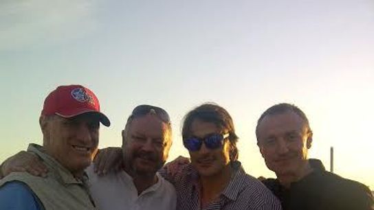 Paul Stewart with Esa, Teemu and Jere photo StewartonSelanneboat.jpg